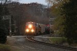 In the limited early morning light, M340 comes rolling around the corner southward